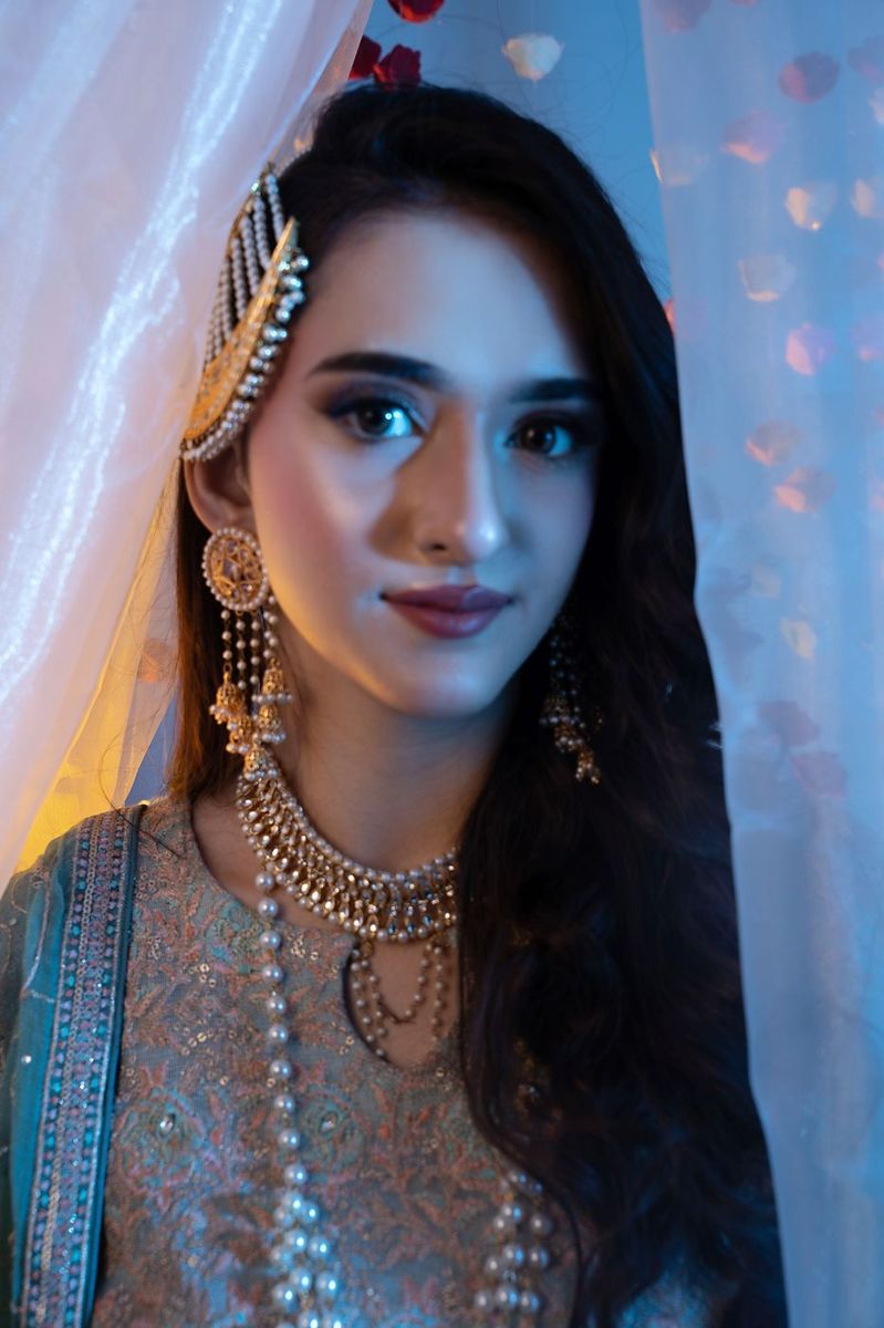 Mehndi look behind sheer curtains