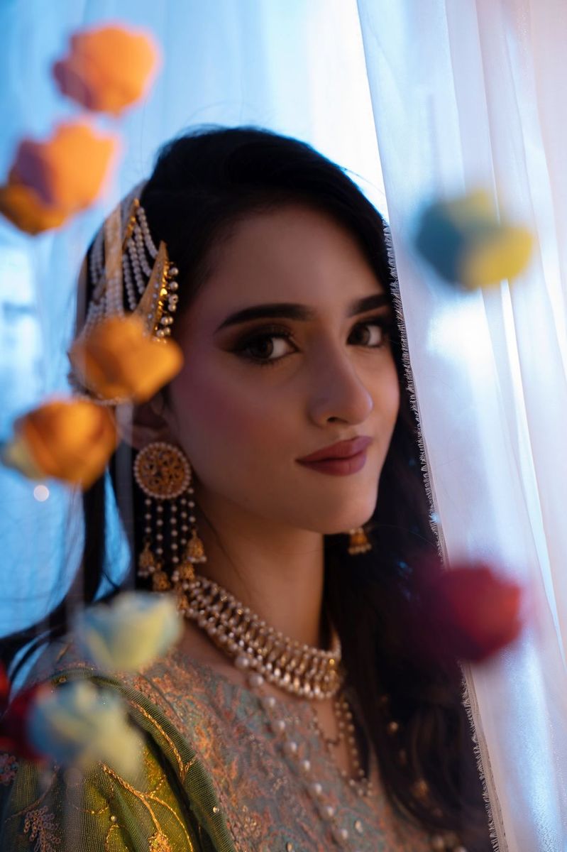 Mehndi look behind sheer curtains