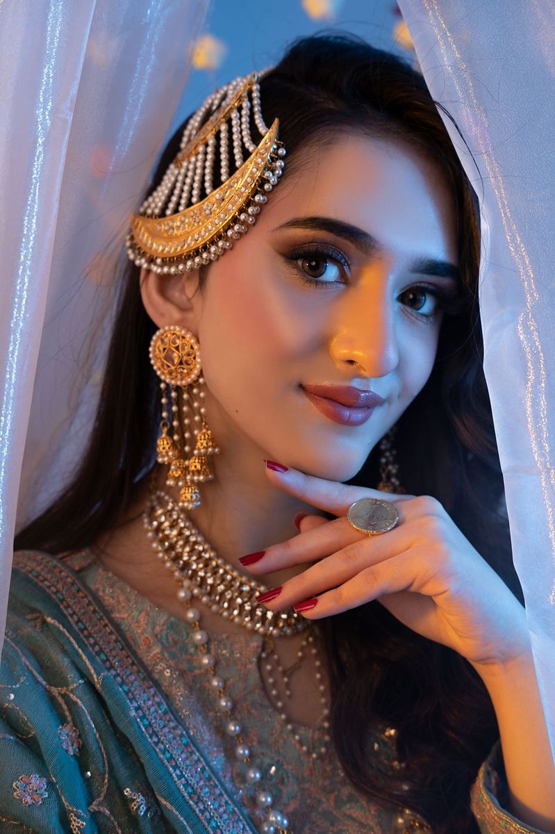 Mehndi look behind sheer curtains
