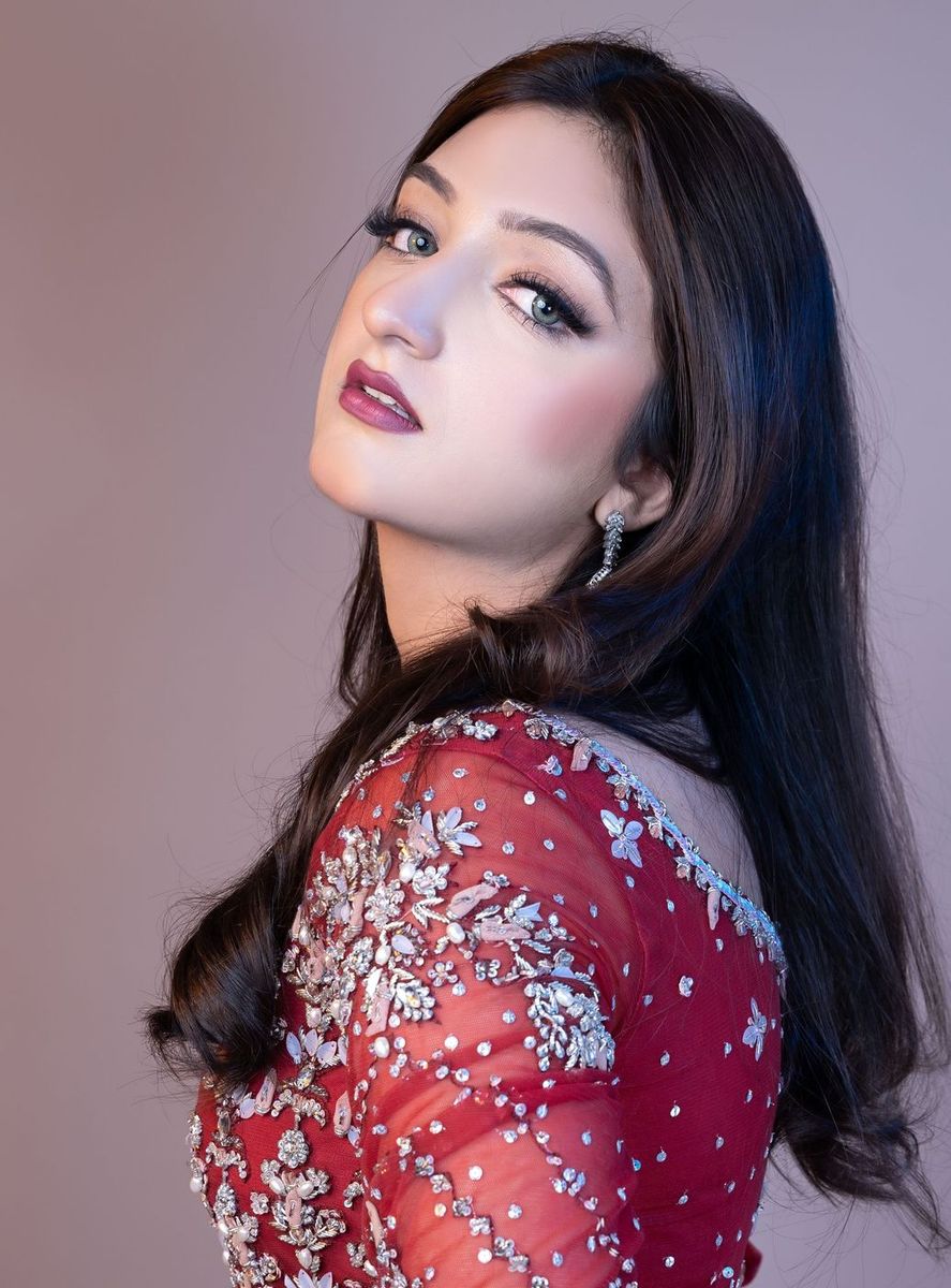 Bride in a deep red embellished gown