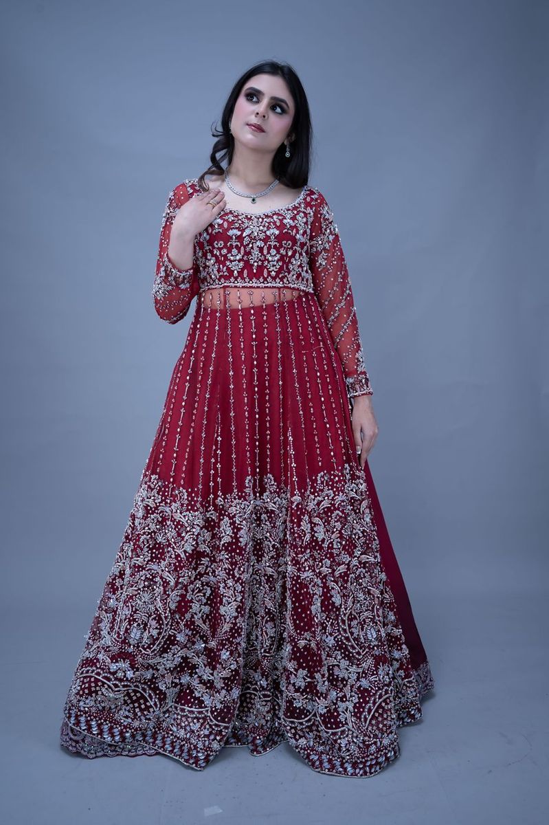 Bride in a scarlet gown with silver work