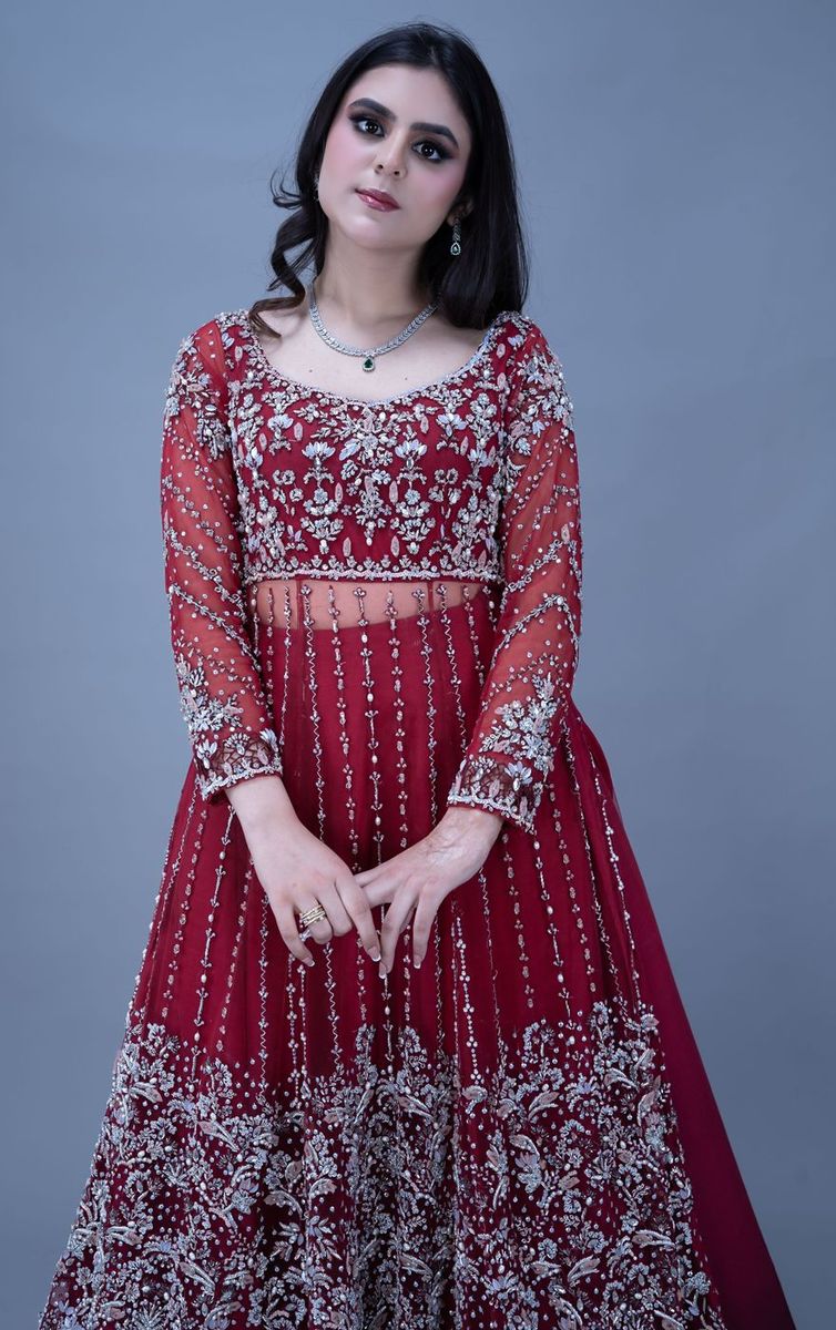 Bride in a scarlet gown with silver work