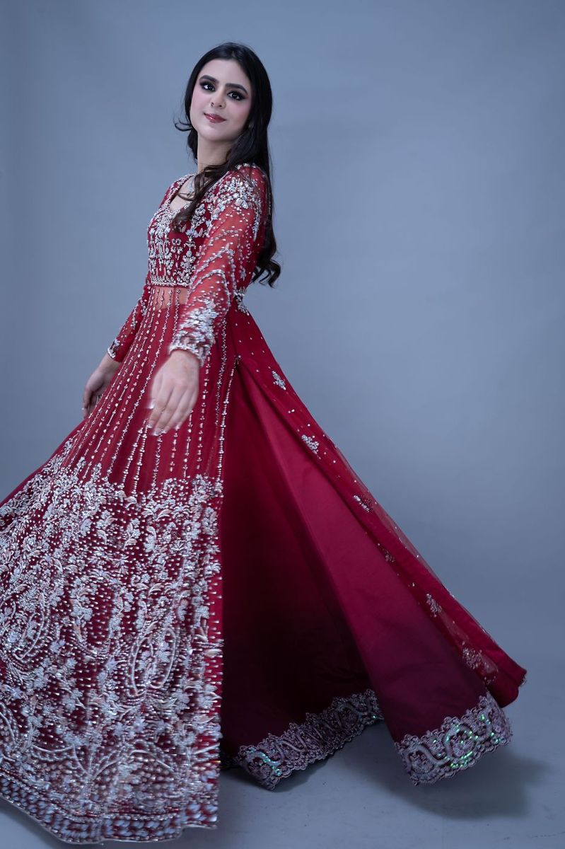 Bride in a scarlet gown with silver work