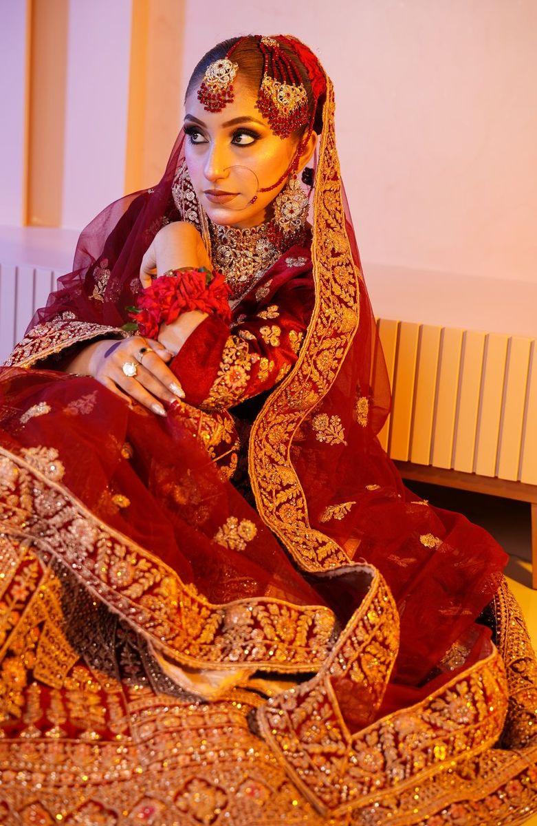 Bride in maroon velvet with gold work