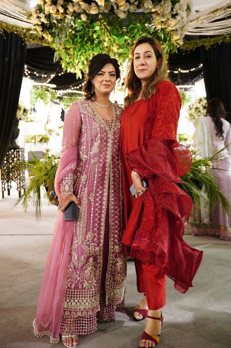 Two guests dressed for an event